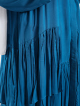 Ruffle Shirt in soft, breathable fabric with delicate frill accents, available in serene summer tones for a feminine modest look