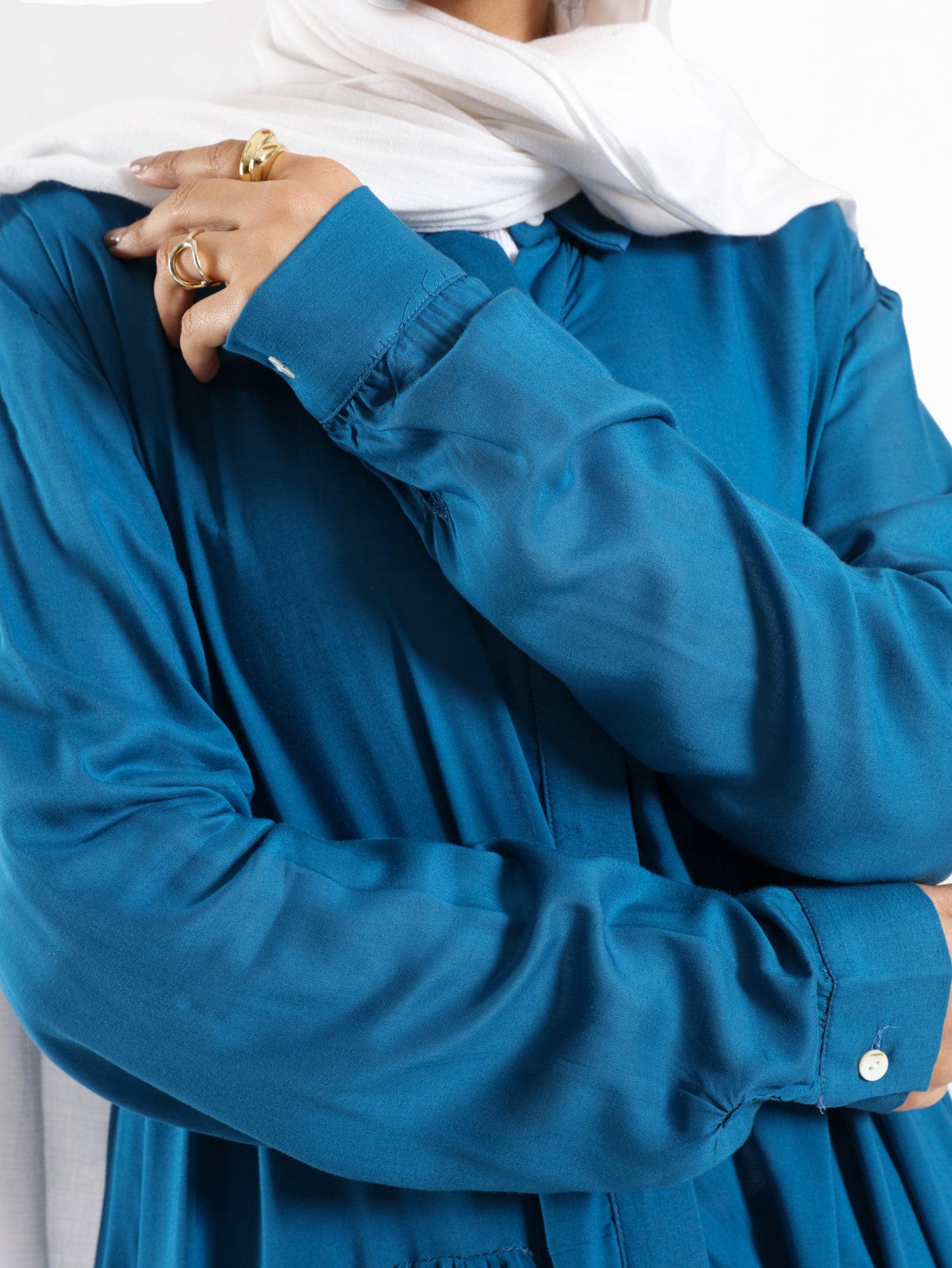 Ruffle Shirt in soft, breathable fabric with delicate frill accents, available in serene summer tones for a feminine modest look