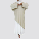 Asymmetrical Cascading Top in smooth crepe with one-sided floral print and draped silhouette, a playful free-size blouse in beige, black, mauve, or lime green