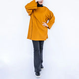 Basic Lines Shirt in cozy cotton with loose-fit silhouette and side pockets, a long-sleeved top in black or mustard for chic winter comfort
