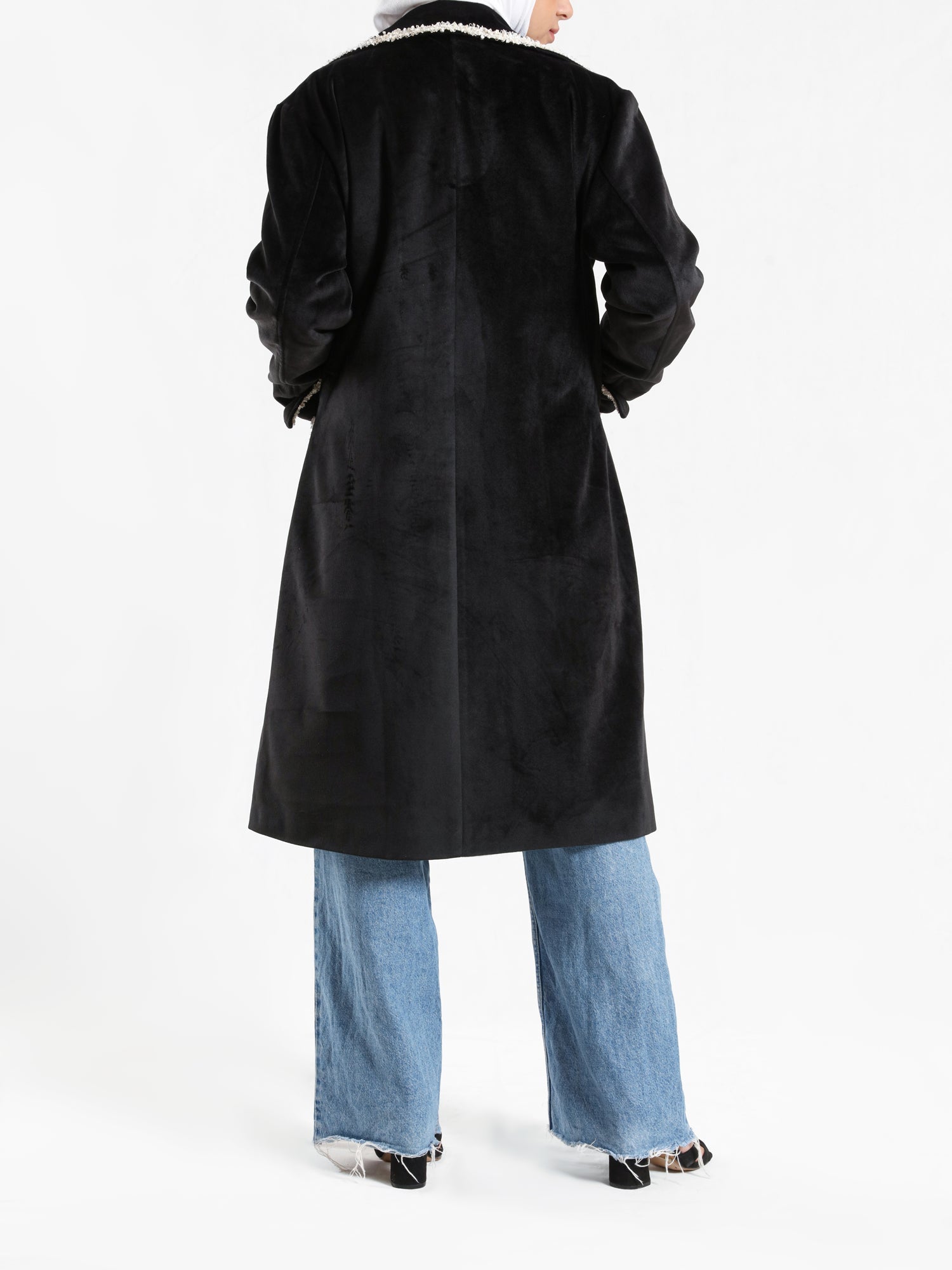 Elegant Suede Coat in black wool with engraved stitching, a long modest winter coat blending warmth, sophistication, and timeless style