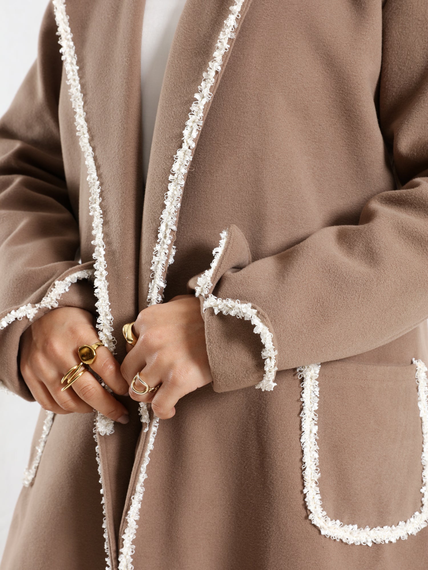 Elegant Wool Coat in warm wool fabric, available in olive and dark beige, blending modest style with seasonal comfort