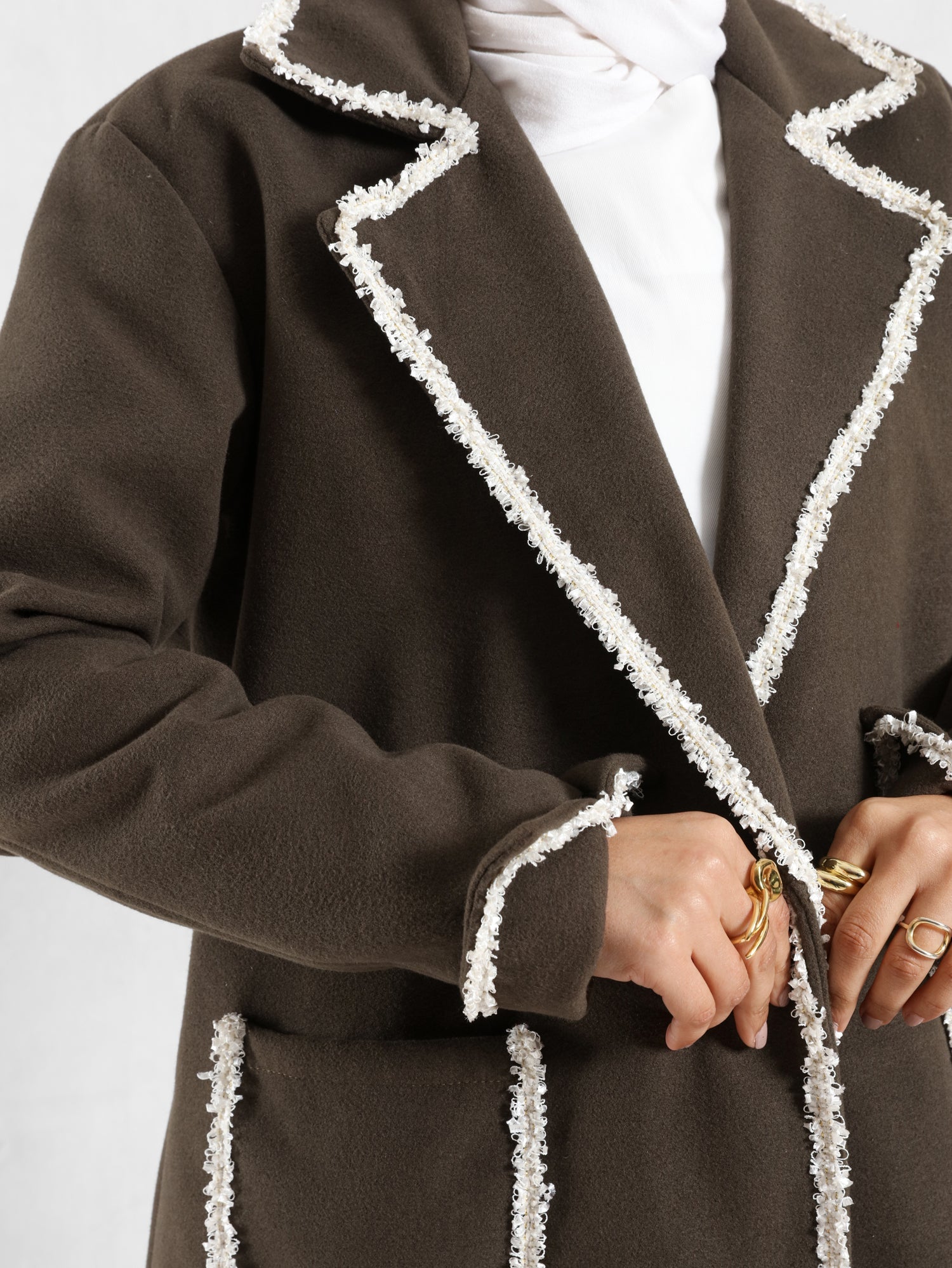 Elegant Wool Coat in warm wool fabric, available in olive and dark beige, blending modest style with seasonal comfort