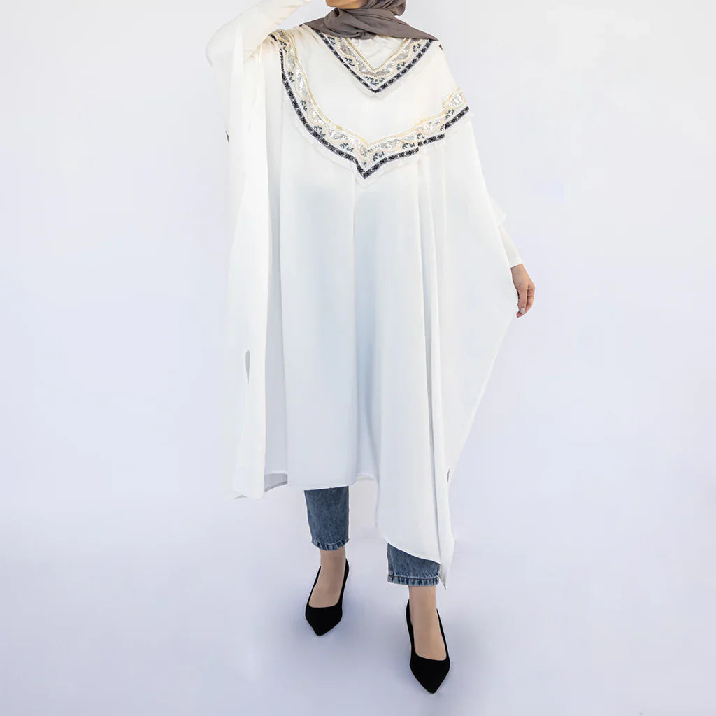 Enchanted V-Neck Cape in Turkish linen-cotton with imported Arabian taps and fluid drape, a striking free-size kaftan in beige, black, blue, or white