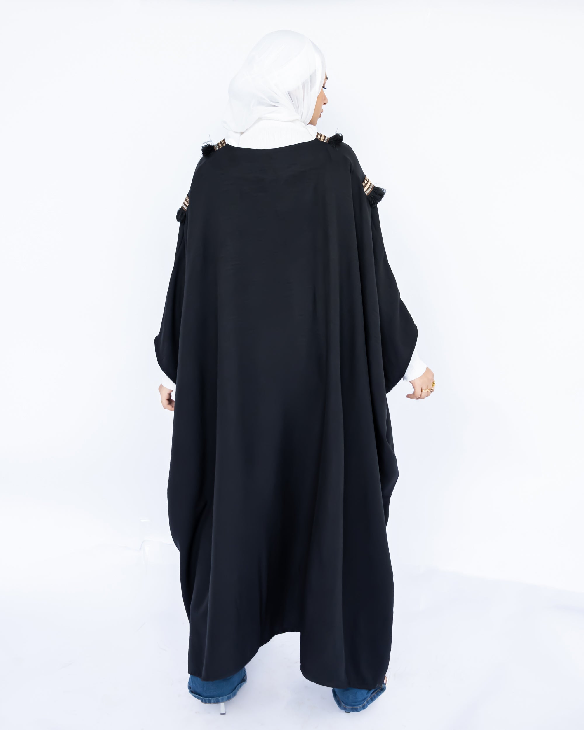 Enchanted V-Neck Cape in Turkish linen-cotton with imported Arabian taps and fluid drape, a striking free-size kaftan in beige, black, blue, or white