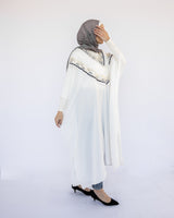 Enchanted V-Neck Cape in Turkish linen-cotton with imported Arabian taps and fluid drape, a striking free-size kaftan in beige, black, blue, or white