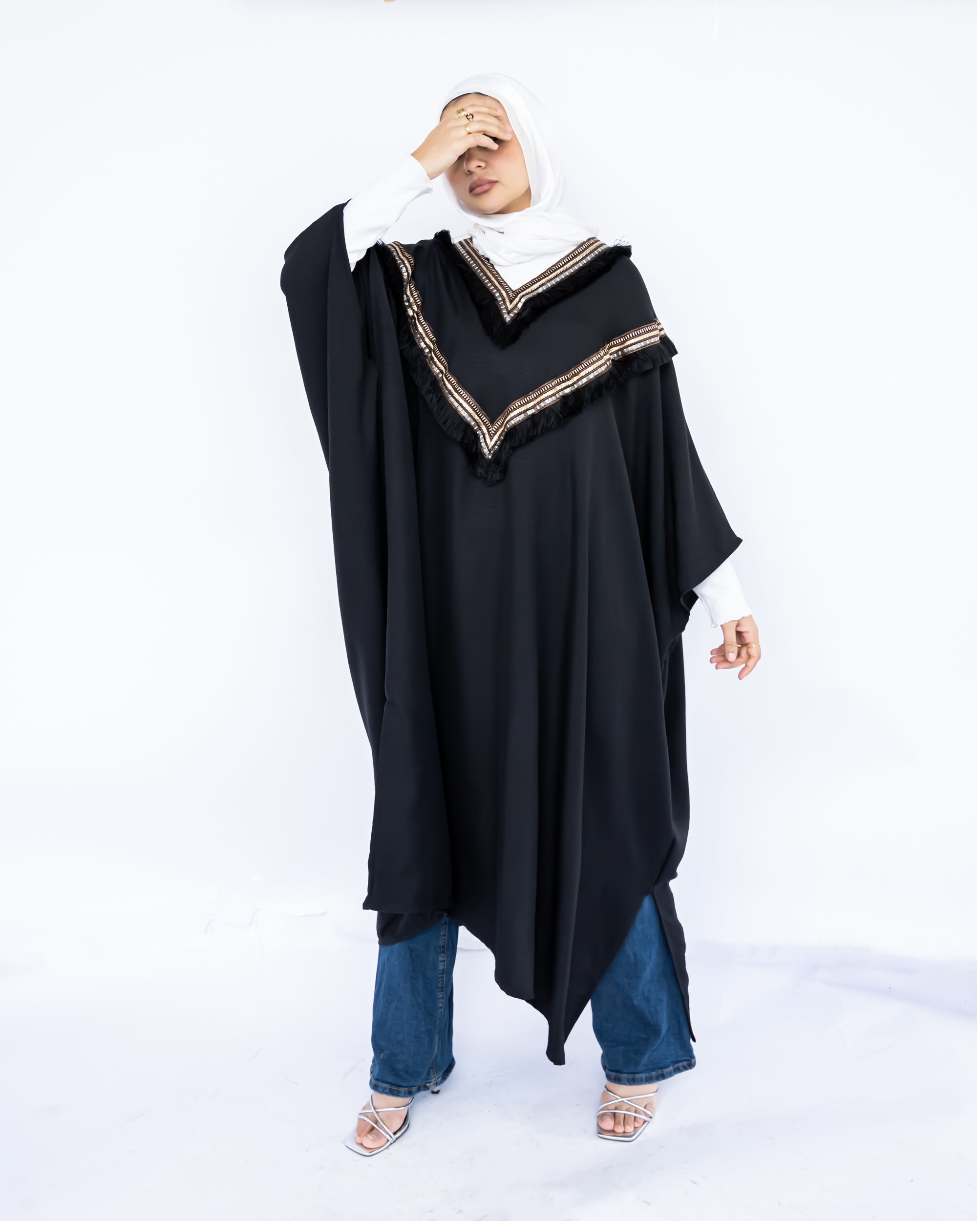 Enchanted V-Neck Cape in Turkish linen-cotton with imported Arabian taps and fluid drape, a striking free-size kaftan in beige, black, blue, or white