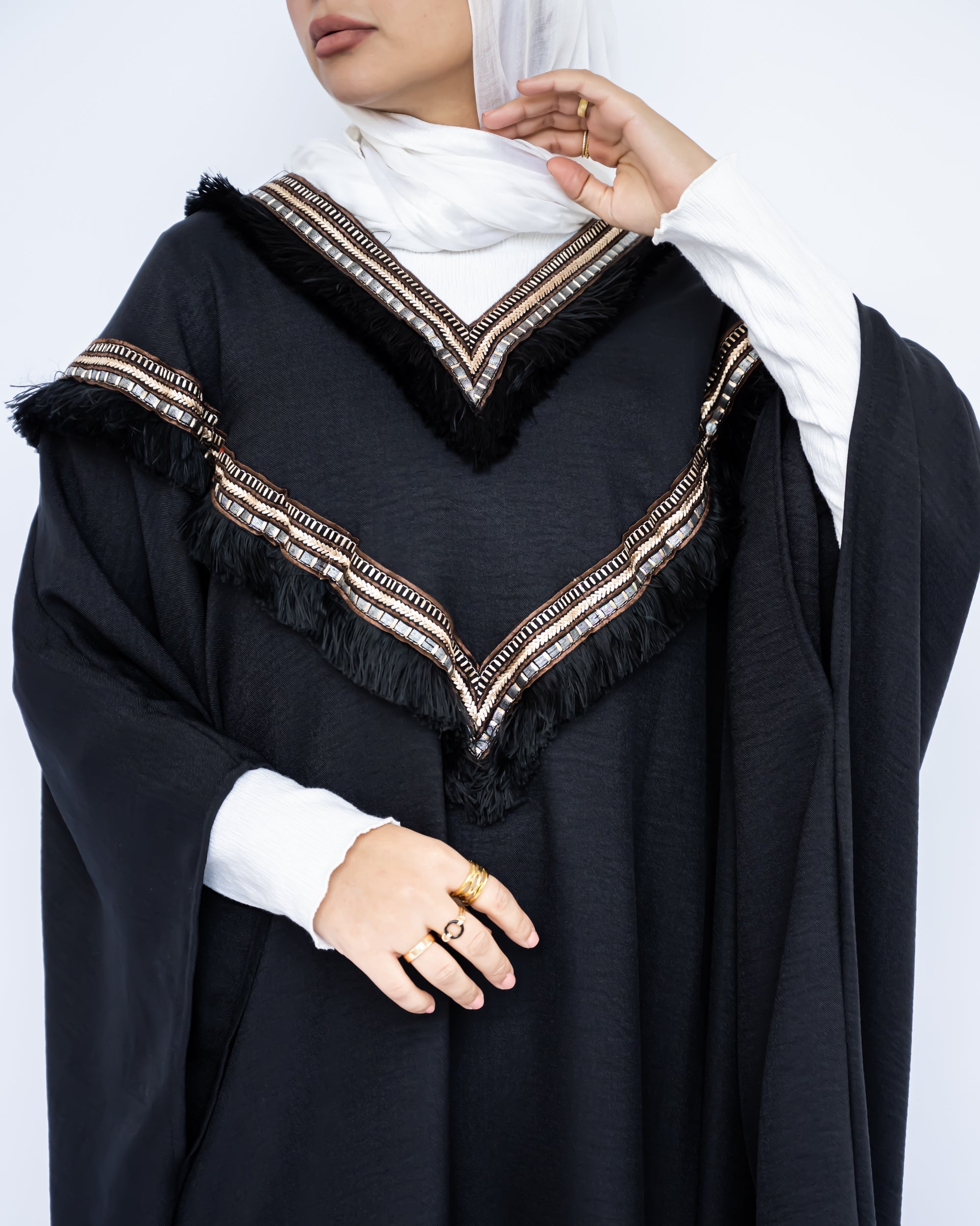 Enchanted V-Neck Cape in Turkish linen-cotton with imported Arabian taps and fluid drape, a striking free-size kaftan in beige, black, blue, or white