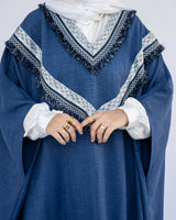 Enchanted V-Neck Cape in Turkish linen-cotton with imported Arabian taps and fluid drape, a striking free-size kaftan in beige, black, blue, or white