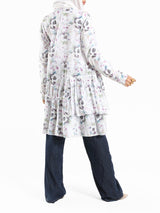 Floral Ruffle Shirt in voile fabric with modest ruffle design, available in white, purple, and yellow for summer wear