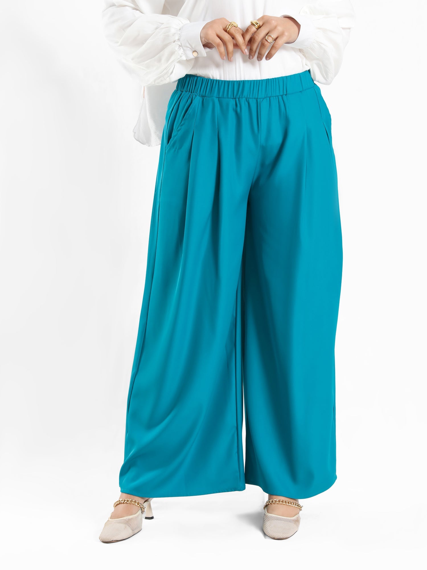 Floret Twirl Pants in wide-leg fit, available in turquoise, black, and beige—lightweight and modest for summer styling