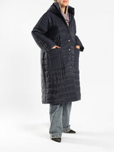 Long waterproof puffer coat with quilted texture and full coverage, ideal for modest winter wear in navy, beige, or grey