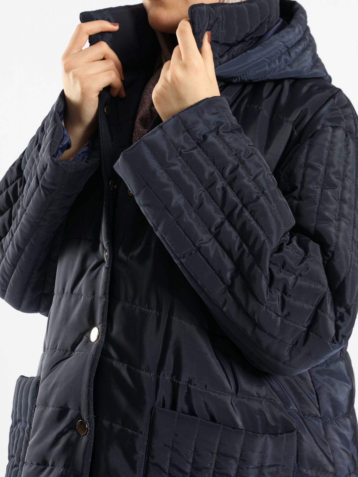 Long waterproof puffer coat with quilted texture and full coverage, ideal for modest winter wear in navy, beige, or grey