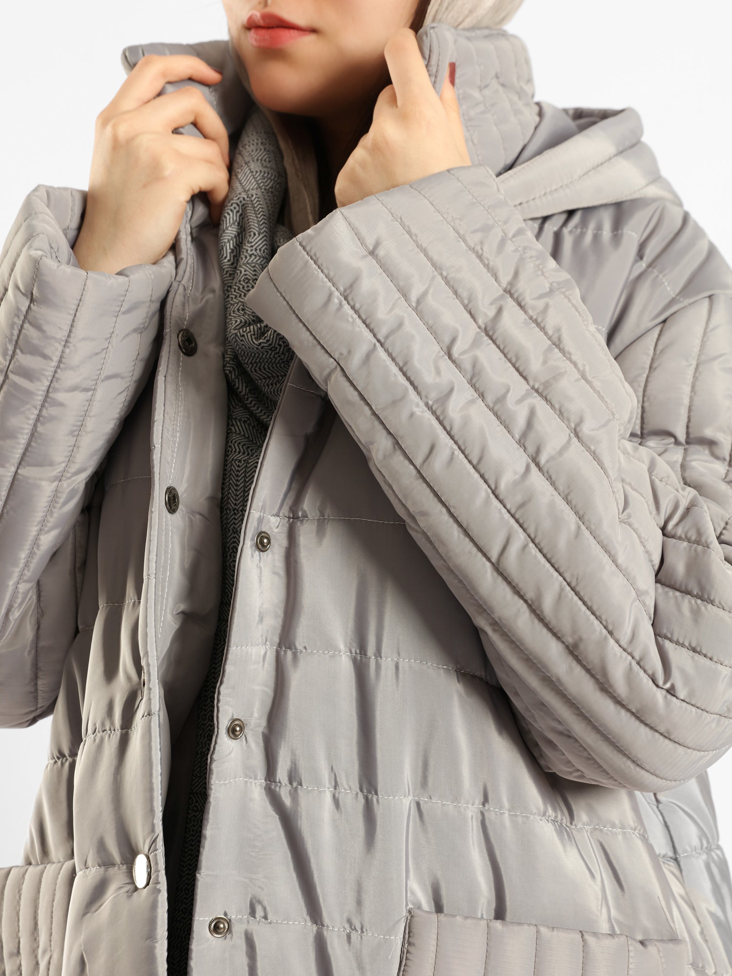 Long waterproof puffer coat with quilted texture and full coverage, ideal for modest winter wear in navy, beige, or grey