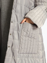 Long waterproof puffer coat with quilted texture and full coverage, ideal for modest winter wear in navy, beige, or grey