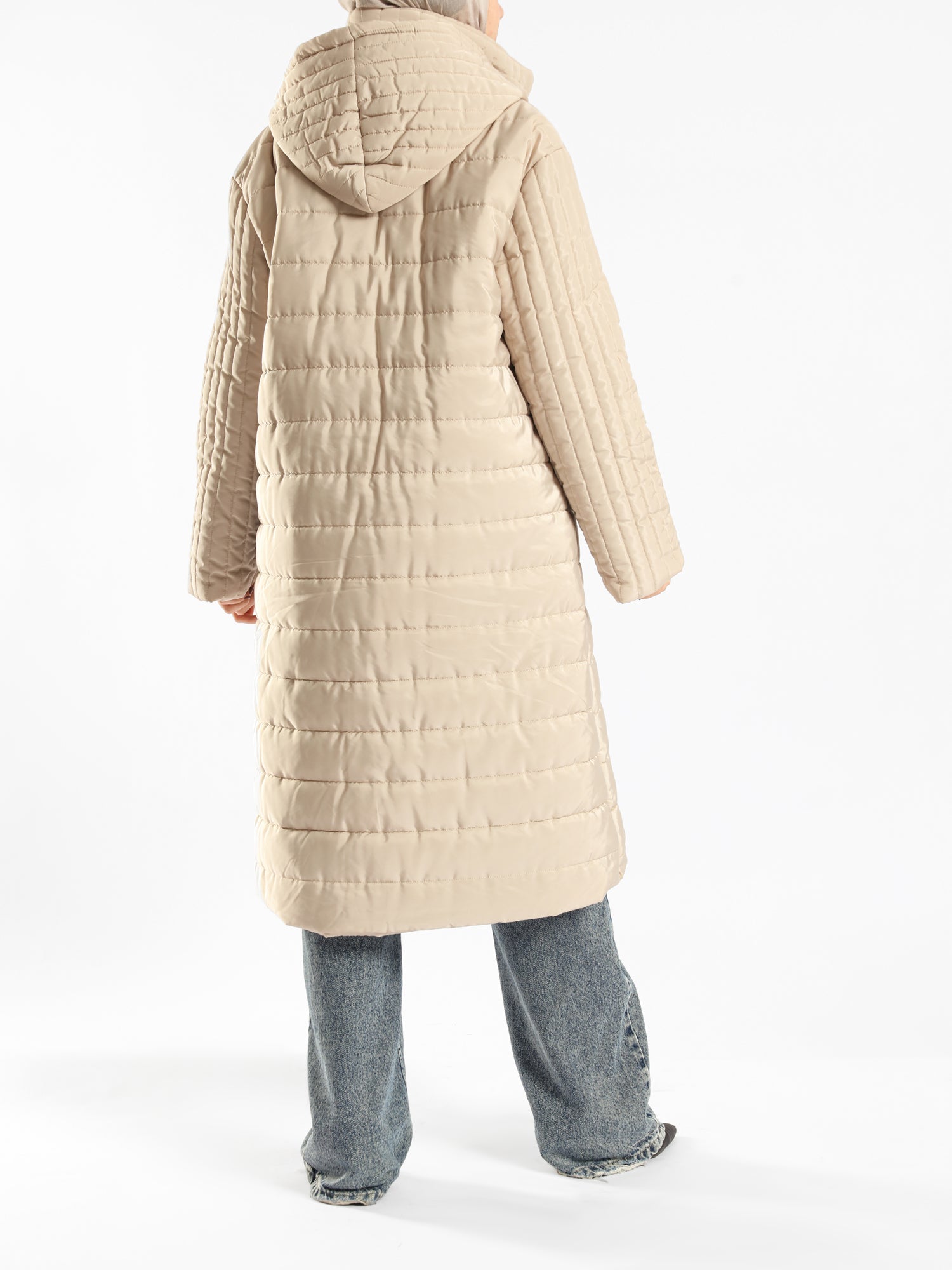 Long waterproof puffer coat with quilted texture and full coverage, ideal for modest winter wear in navy, beige, or grey