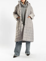 Long waterproof puffer coat with quilted texture and full coverage, ideal for modest winter wear in navy, beige, or grey