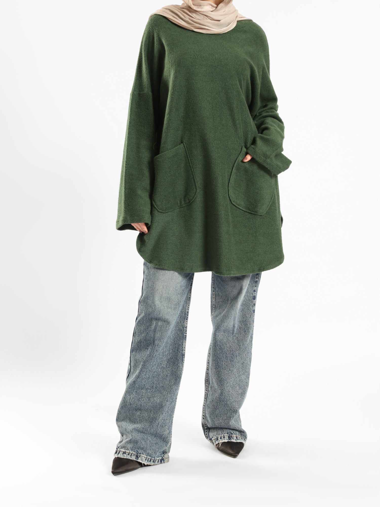 Oversized Pocketed Sweater in dark green, orange, gray, or green—relaxed fit with front pockets for bold winter layering