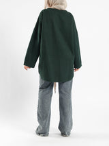 Oversized Pocketed Sweater in dark green, orange, gray, or green—relaxed fit with front pockets for bold winter layering