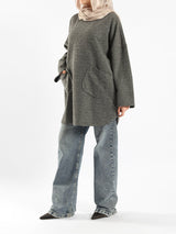 Oversized Pocketed Sweater in dark green, orange, gray, or green—relaxed fit with front pockets for bold winter layering