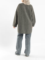 Oversized Pocketed Sweater in dark green, orange, gray, or green—relaxed fit with front pockets for bold winter layering