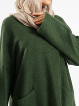 Oversized Pocketed Sweater in dark green, orange, gray, or green—relaxed fit with front pockets for bold winter layering