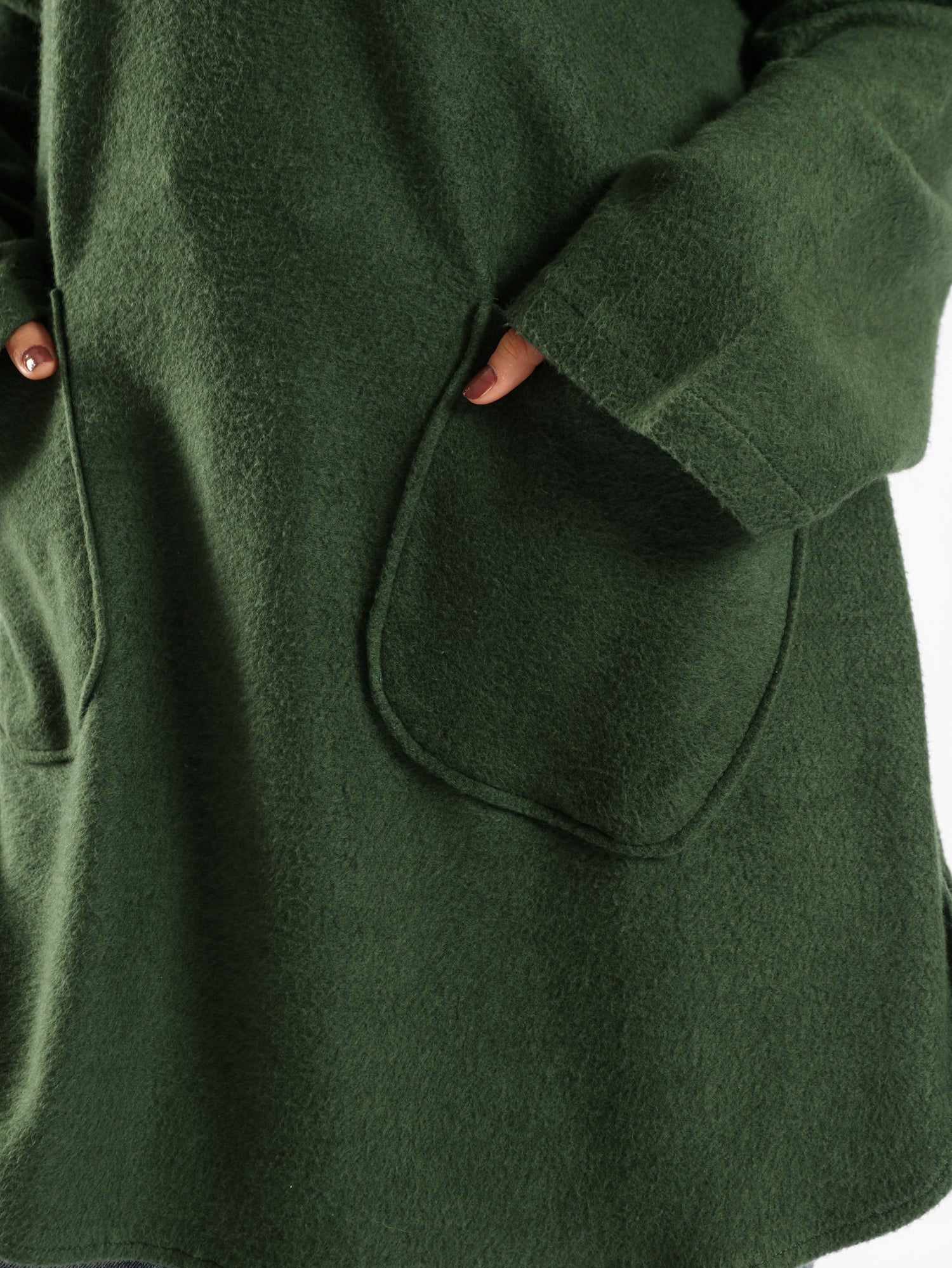 Oversized Pocketed Sweater in dark green, orange, gray, or green—relaxed fit with front pockets for bold winter layering