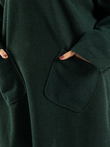 Oversized Pocketed Sweater in dark green, orange, gray, or green—relaxed fit with front pockets for bold winter layering