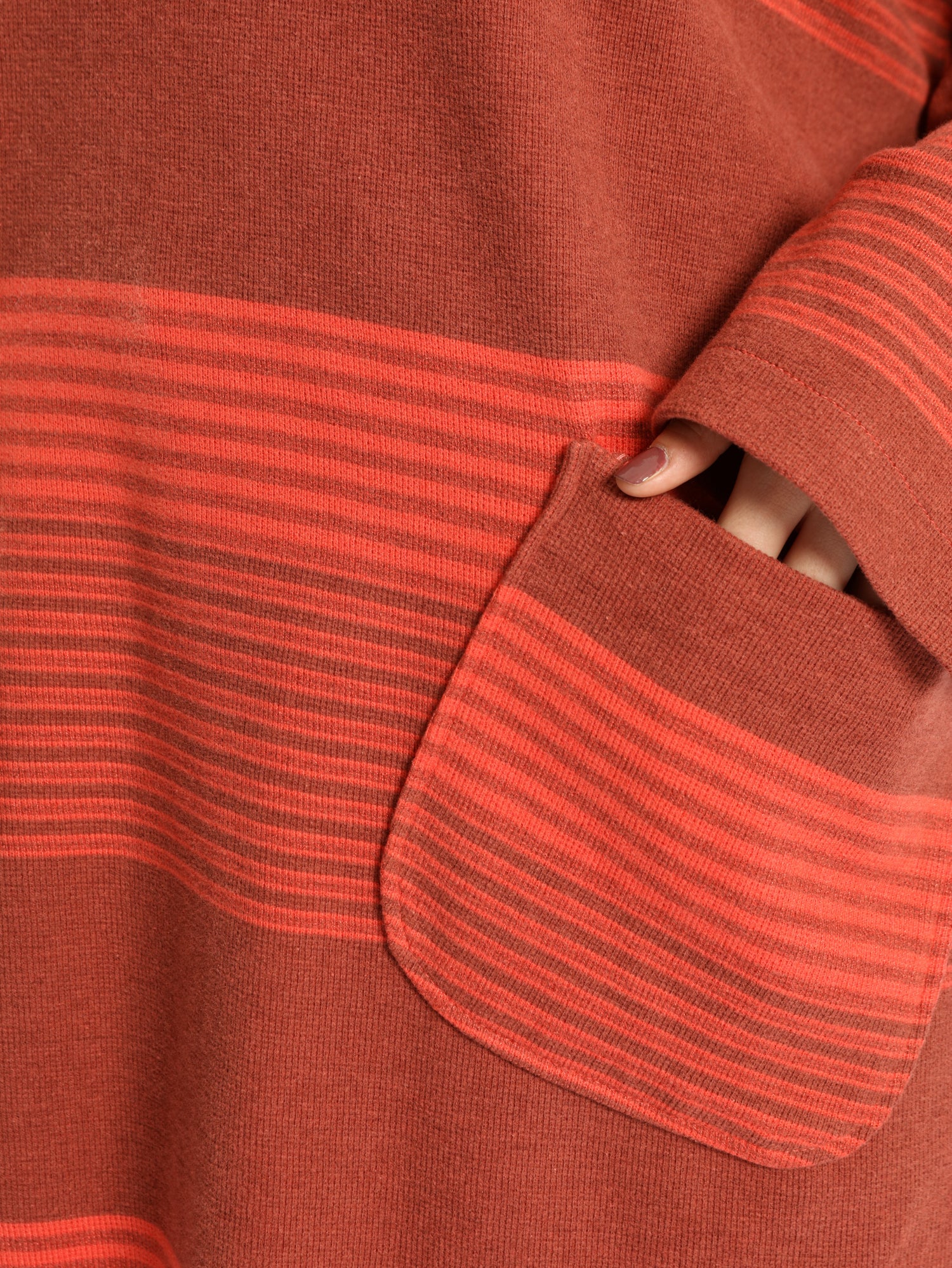 Oversized Pocketed Sweater in dark green, orange, gray, or green—relaxed fit with front pockets for bold winter layering