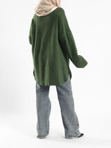Oversized Pocketed Sweater in dark green, orange, gray, or green—relaxed fit with front pockets for bold winter layering