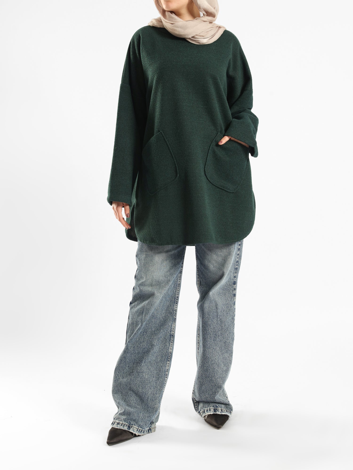Oversized Pocketed Sweater in dark green, orange, gray, or green—relaxed fit with front pockets for bold winter layering