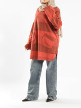 Oversized Pocketed Sweater in dark green, orange, gray, or green—relaxed fit with front pockets for bold winter layering