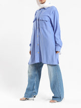 Petal Pocket Blouse in linen blend with front pockets, a relaxed-fit modest top in baby blue, mauve, or white for summer wear
