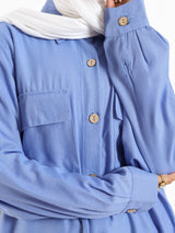 Petal Pocket Blouse in linen blend with front pockets, a relaxed-fit modest top in baby blue, mauve, or white for summer wear