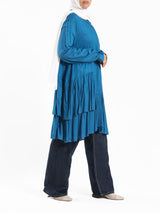 Ruffle Shirt in soft, breathable fabric with delicate frill accents, available in serene summer tones for a feminine modest look