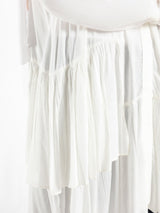 Ruffle Shirt in soft, breathable fabric with delicate frill accents, available in serene summer tones for a feminine modest look