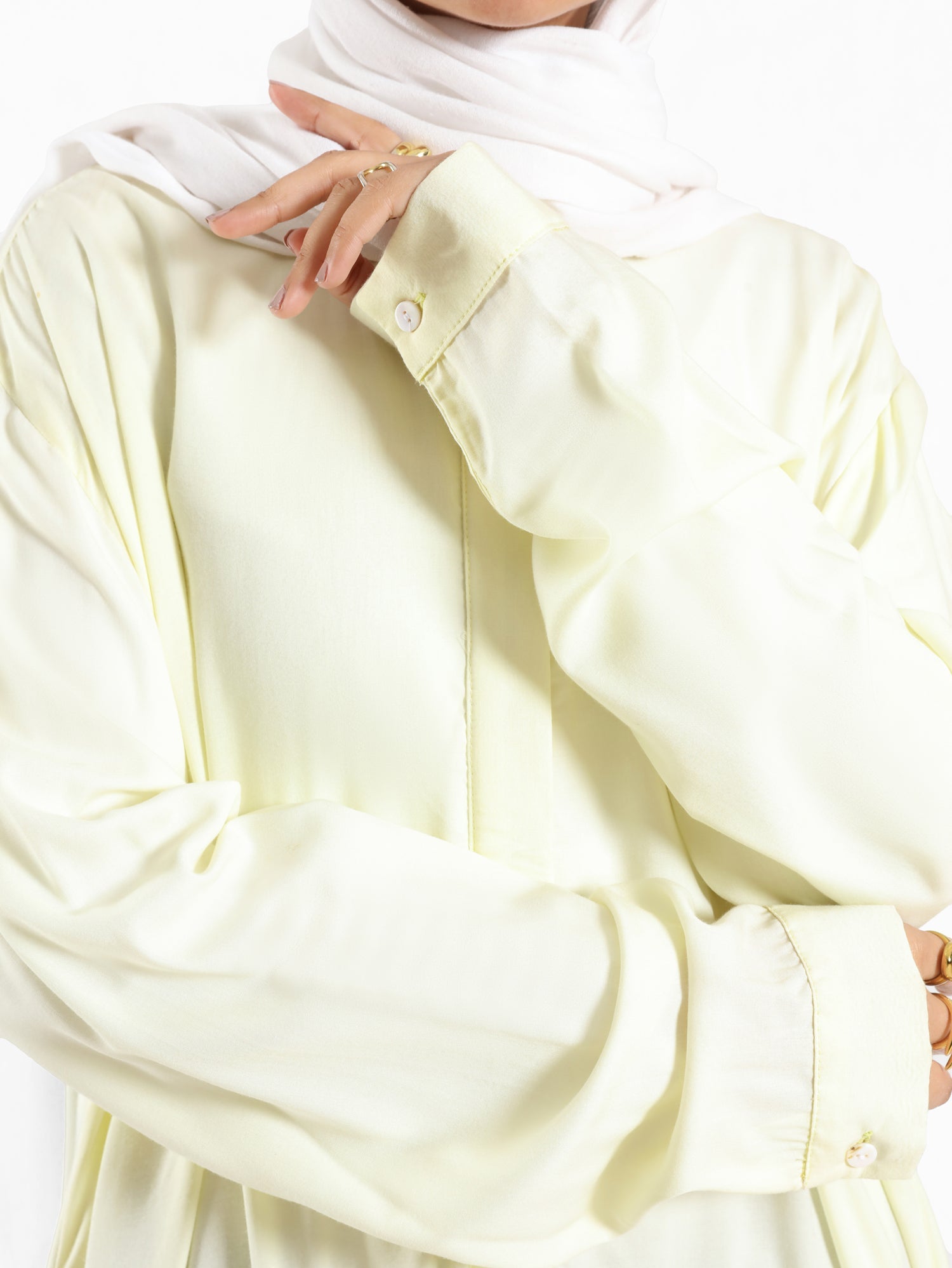 Ruffle Shirt in soft, breathable fabric with delicate frill accents, available in serene summer tones for a feminine modest look