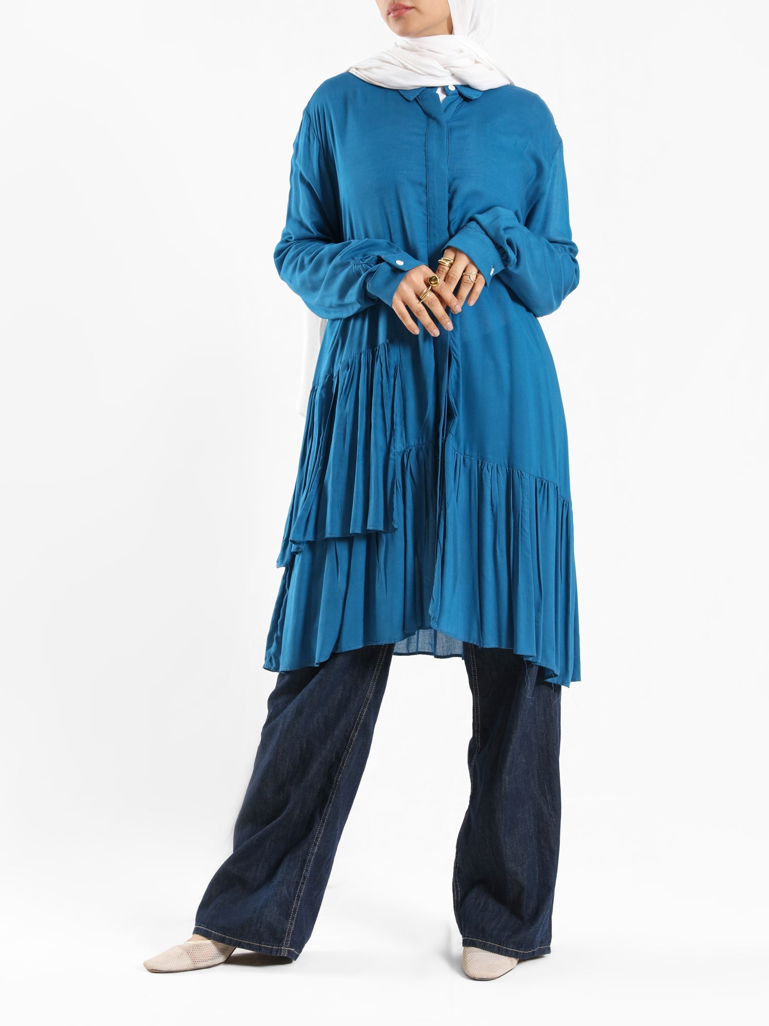 Ruffle Shirt in soft, breathable fabric with delicate frill accents, available in serene summer tones for a feminine modest look