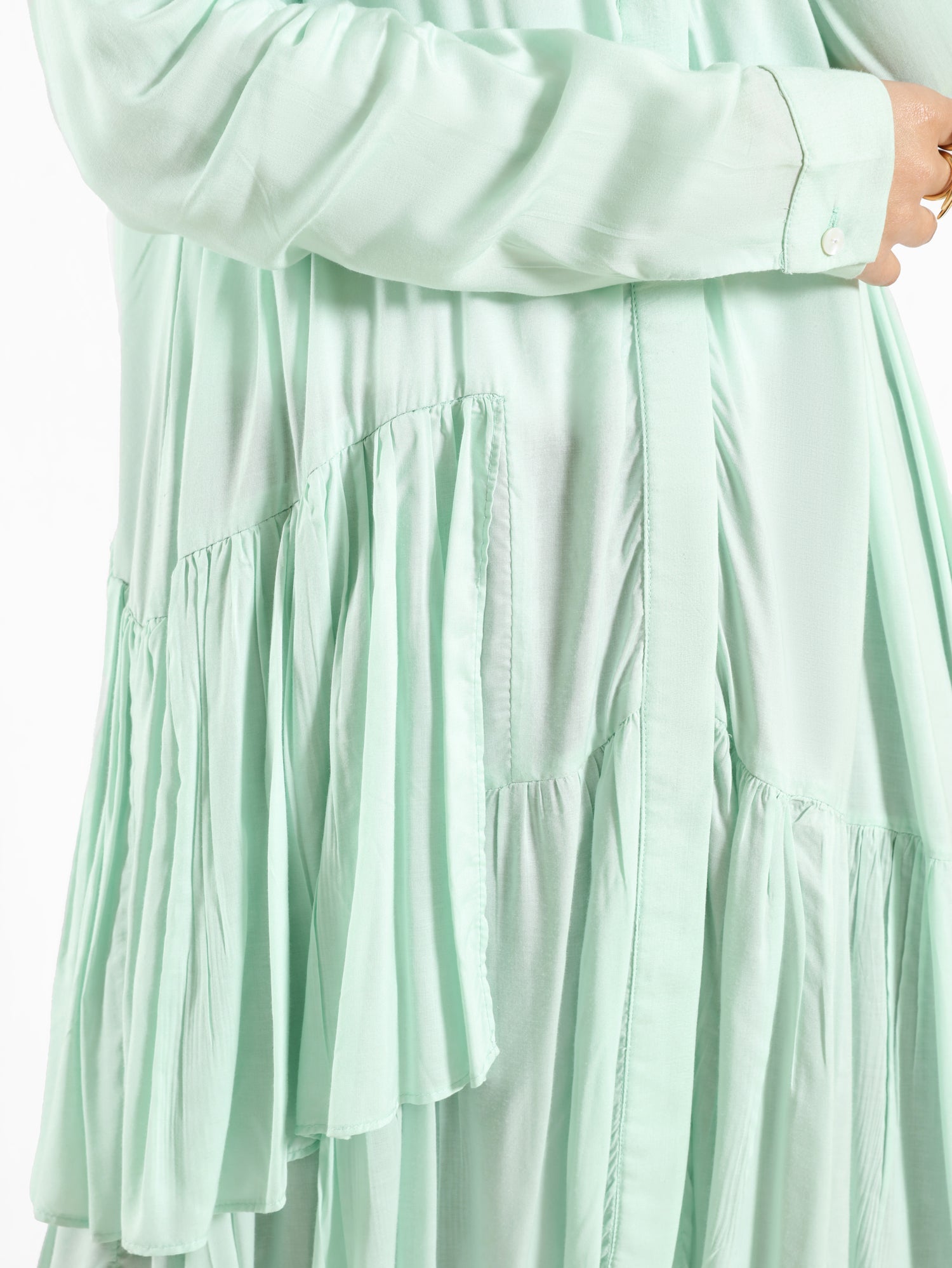 Ruffle Shirt in soft, breathable fabric with delicate frill accents, available in serene summer tones for a feminine modest look