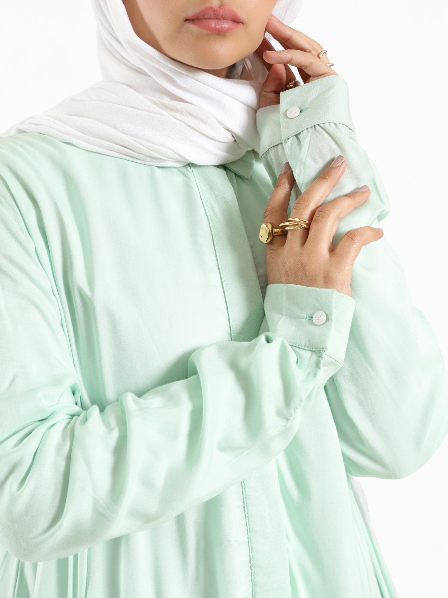 Ruffle Shirt in soft, breathable fabric with delicate frill accents, available in serene summer tones for a feminine modest look