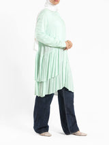 Ruffle Shirt in soft, breathable fabric with delicate frill accents, available in serene summer tones for a feminine modest look